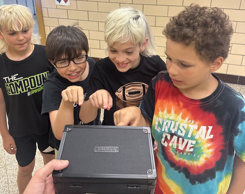 Students solve puzzles in Escape Room Project.