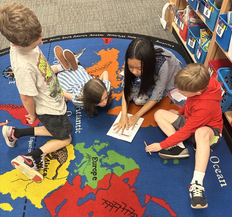 Students solve puzzles in Escape Room Project.