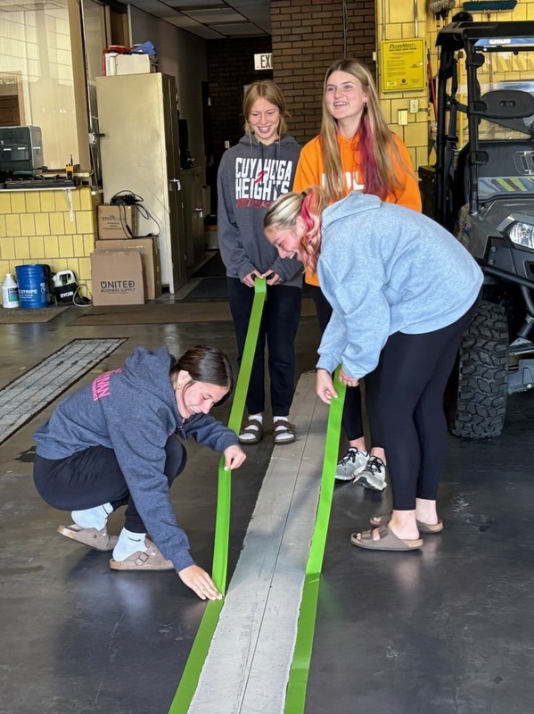 Removing tape from paint lines. 