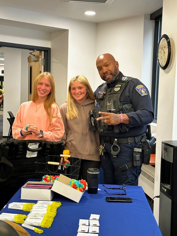 Students visit with exhibitors at E4ME event.