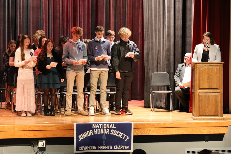 NHS Advisor Abbey Neidert leads NJHS inductees in reciteing their pledge. 