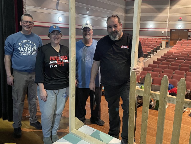 Parents/volunteers working on the set. 