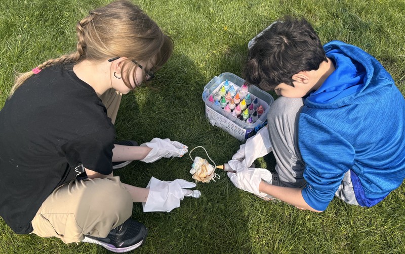 Student tie-dye items at the Inclusion Mixer. 