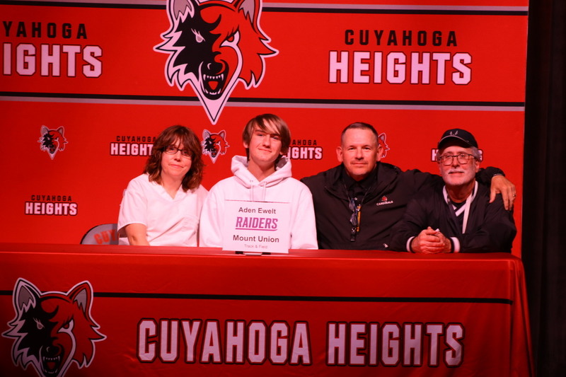 Aden and his mother and coaches. 