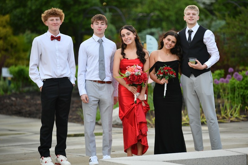 Students pose in garden.