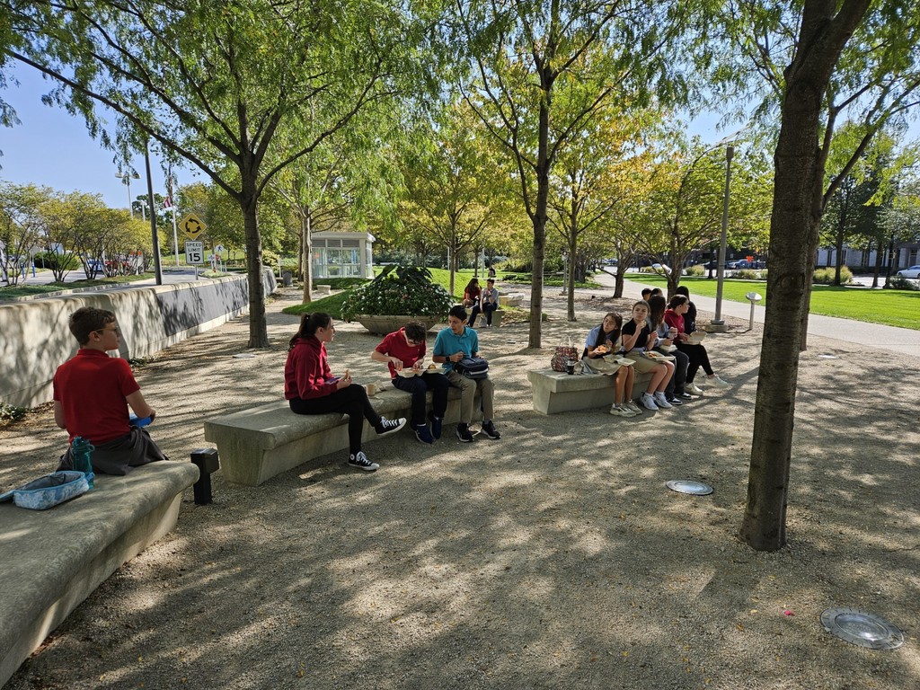 students enjoying lunch outside