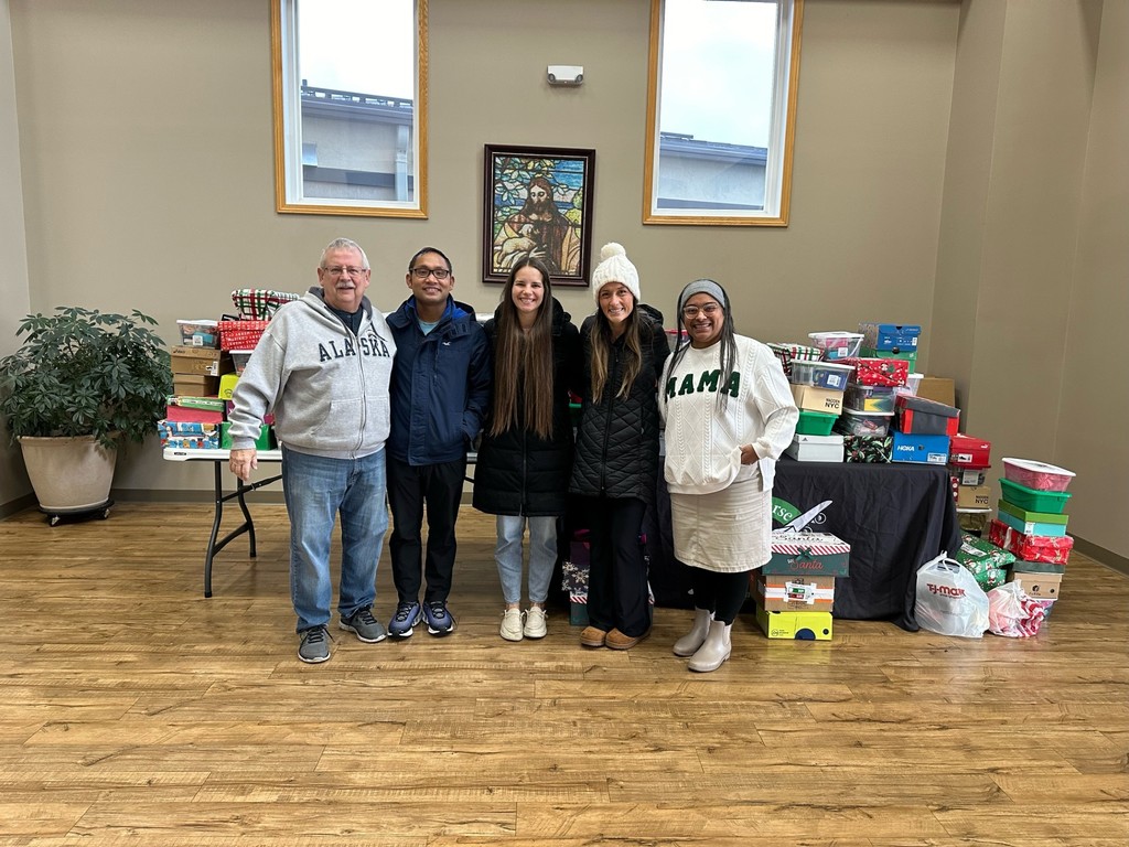 volunteers dropping off Operation Christmas Child boxes