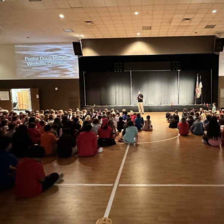 Pastor McCoy speaking to students  