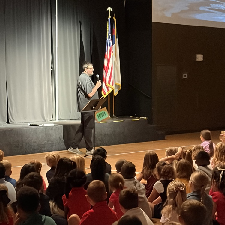 Pastor Lewis speaking to students in chapel