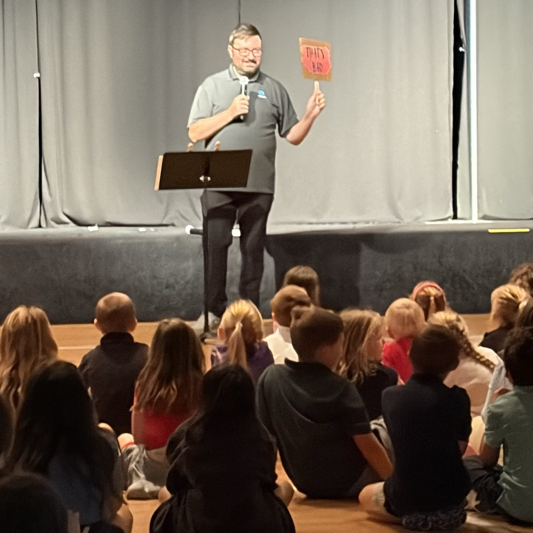 Pastor Lewis speaking to students in chapel