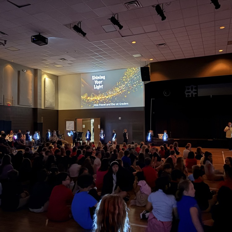 first grade students demonstrating shining God’s light