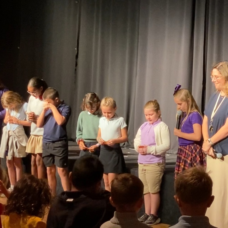 students praying before chapel