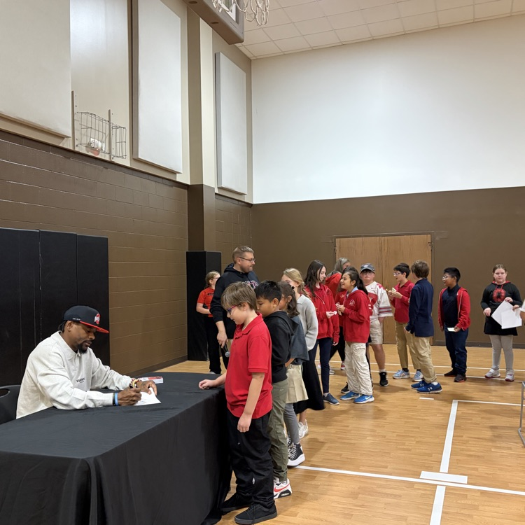 Ted Ginn Jr signing autographs for CCS students