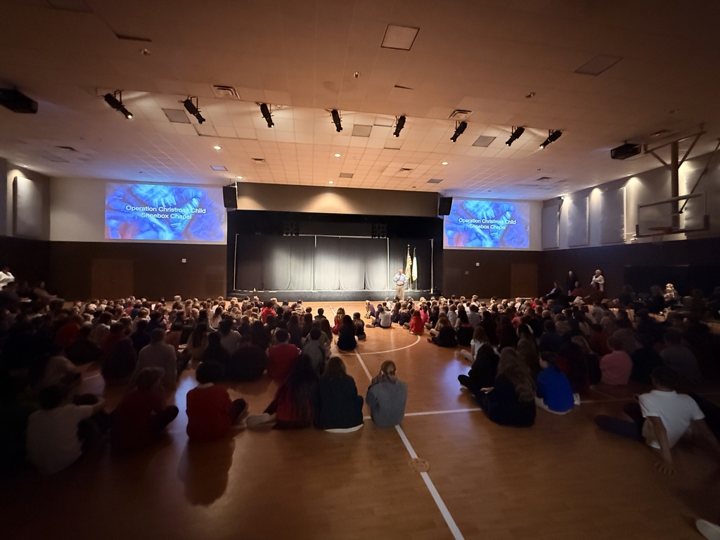 Mr. John speaking to students in chapel.