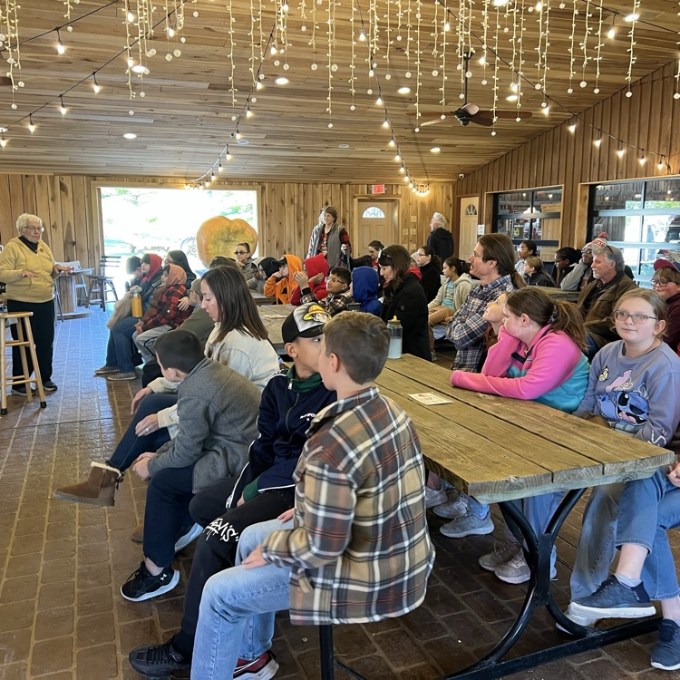 fifth grade students listening to a presentation