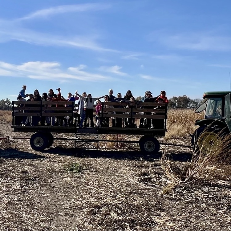 fifth grade students on a wagon ride