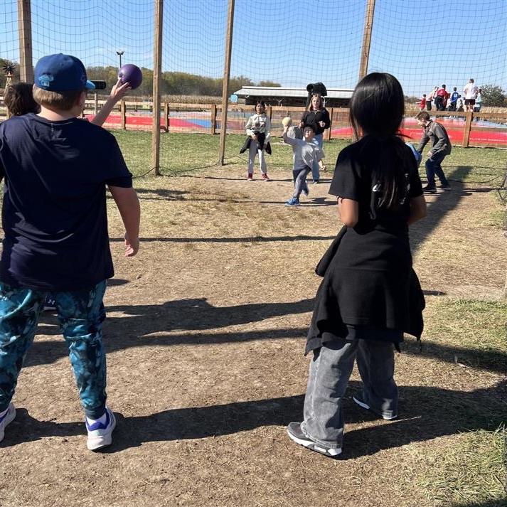 fifth graders playing on a field trip