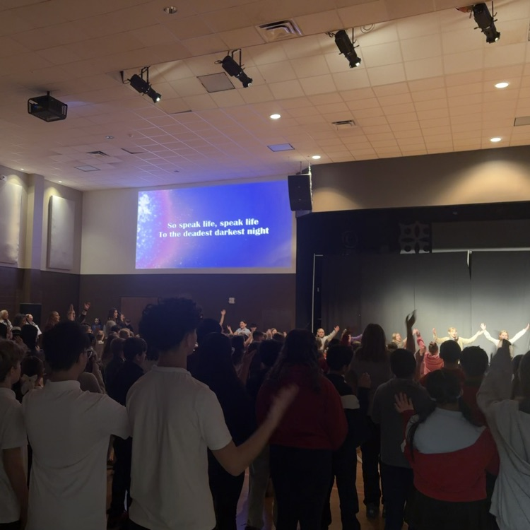 students worshipping at chapel