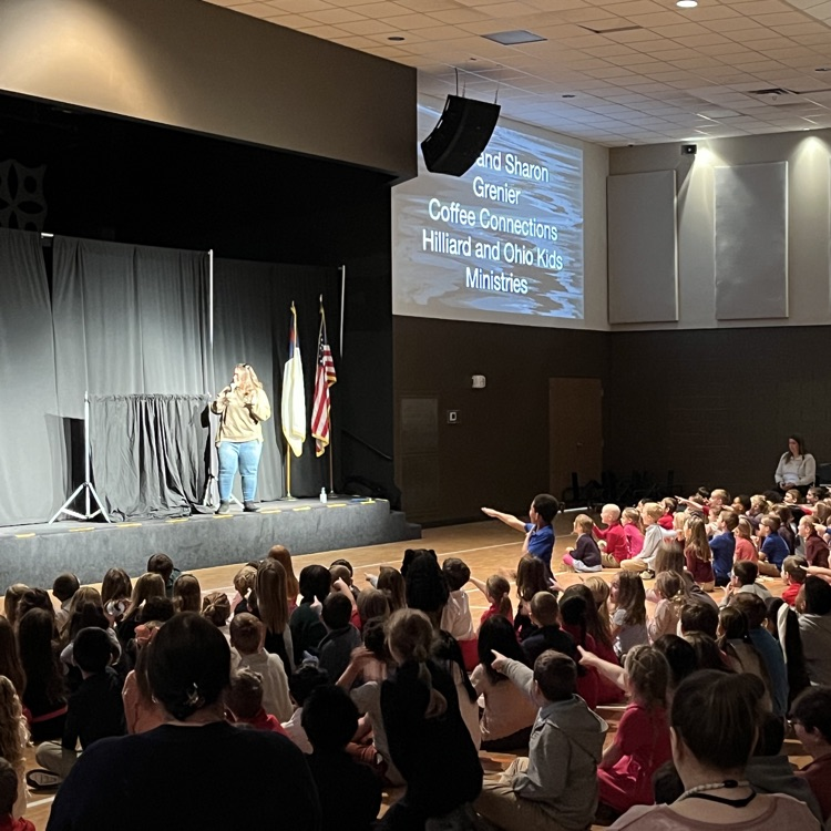 Shanon G. speaking to students in chapel