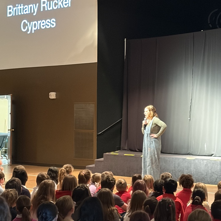 Brittany Rucker speaking to students in chapel