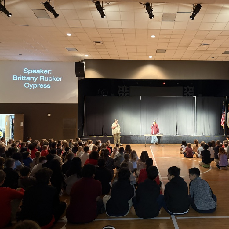 students looking on as Brittany reveals the tongue she brought