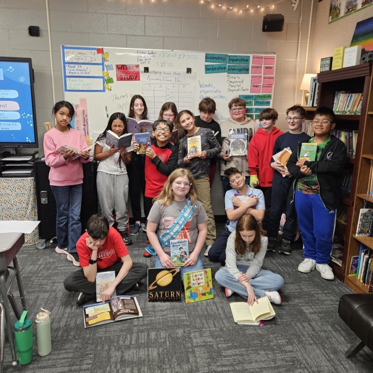 5th graders showing off their books