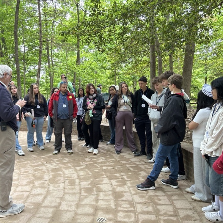 students and their tour guide on eighth grade trip
