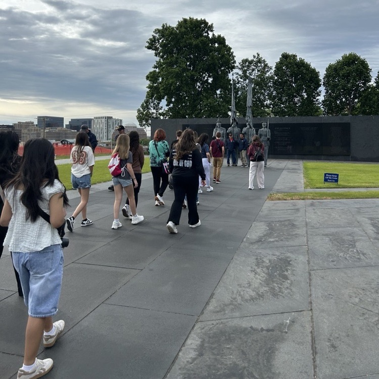 students visiting memorials on eighth grade trip