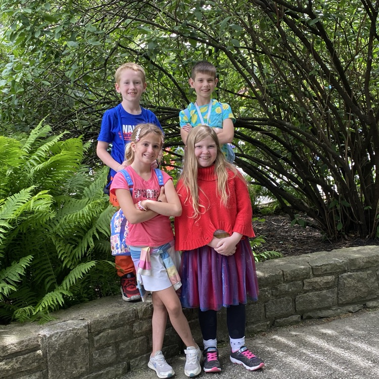 for second grade, students posing in front of trees