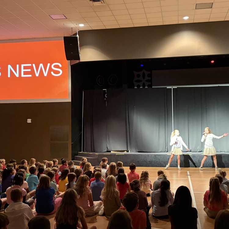 students sharing news about the school with students