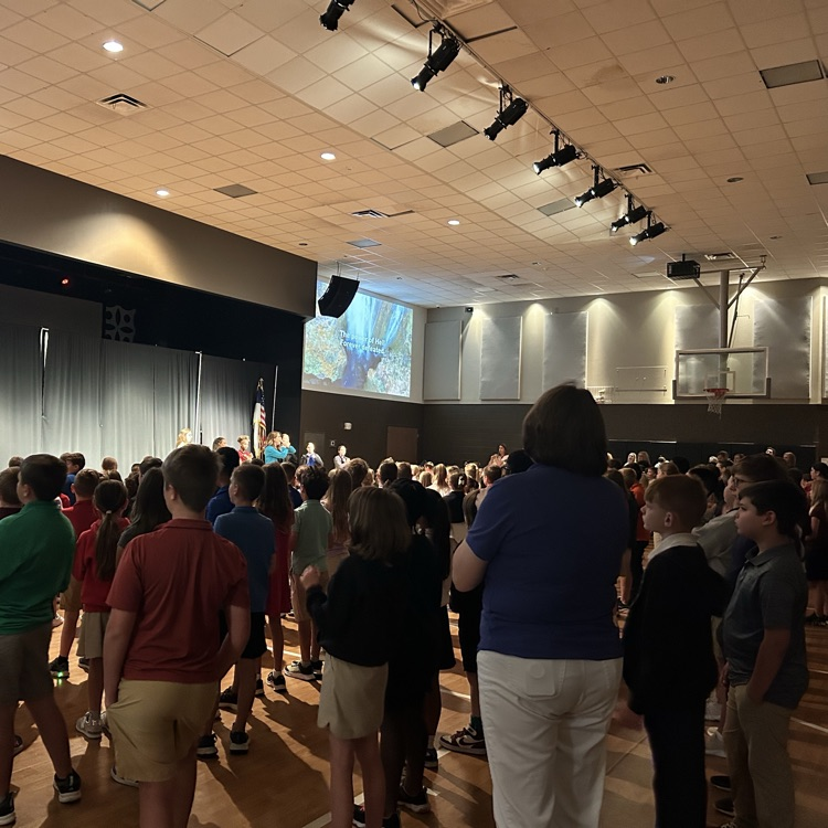 students and teachers worshipping in chapel