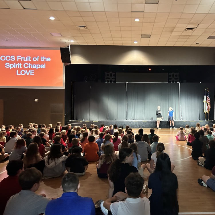 students introducing speaker for chapel