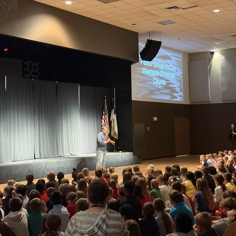students listening to Pastor McCoy