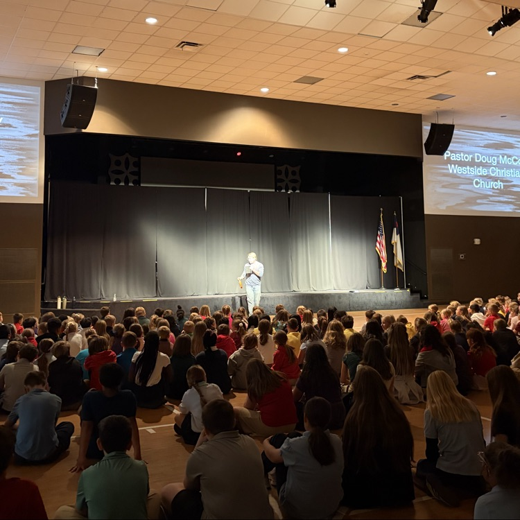 students listening to Pastor McCoy