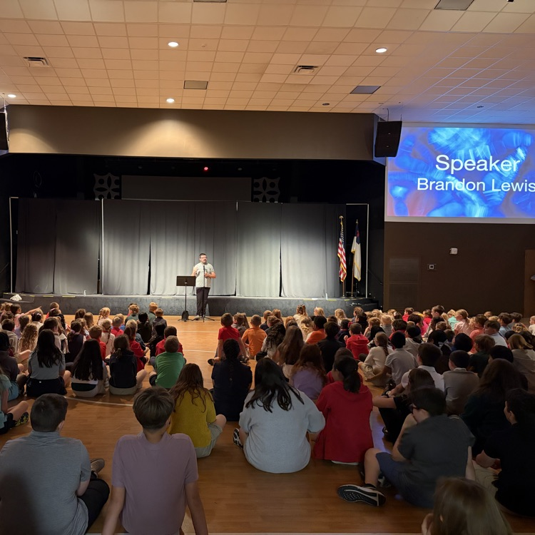 students listening to Pastor Lewis