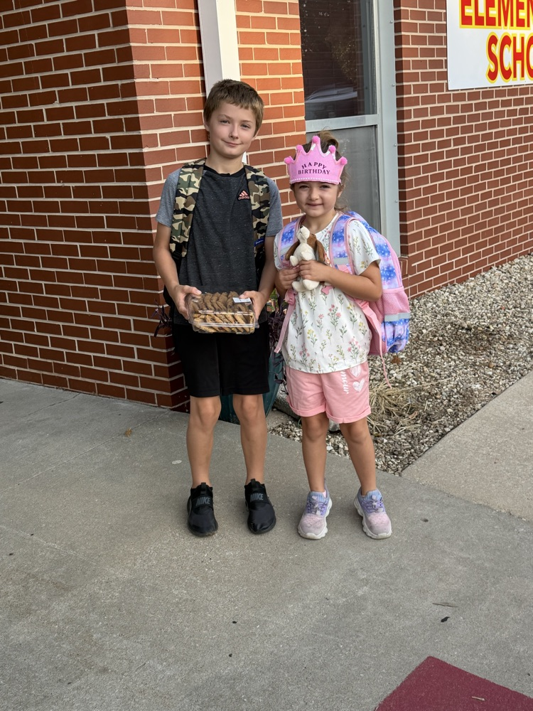 2 elementary students at morning car line  