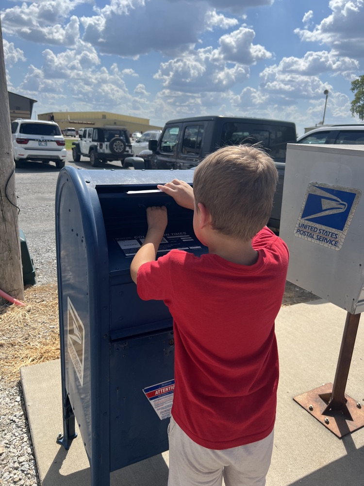 student mailing a letter