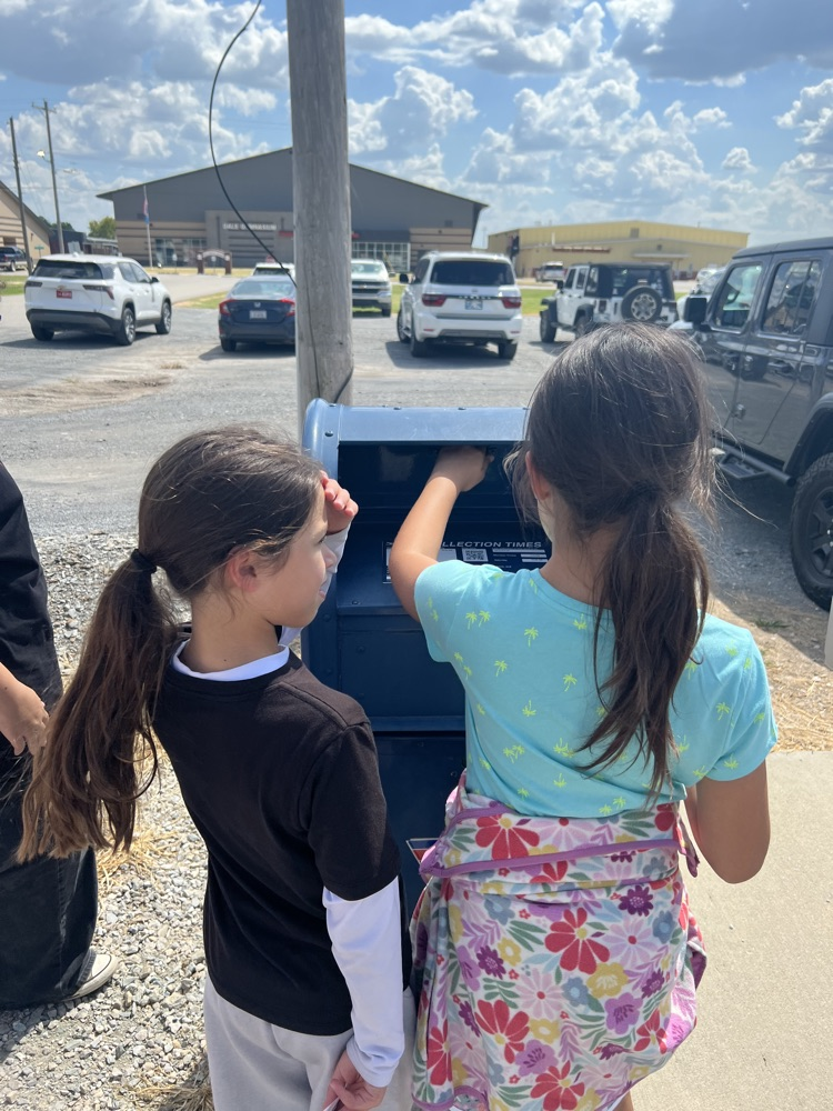 student mailing a letter