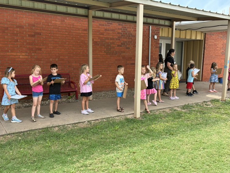 students outside with clipboards