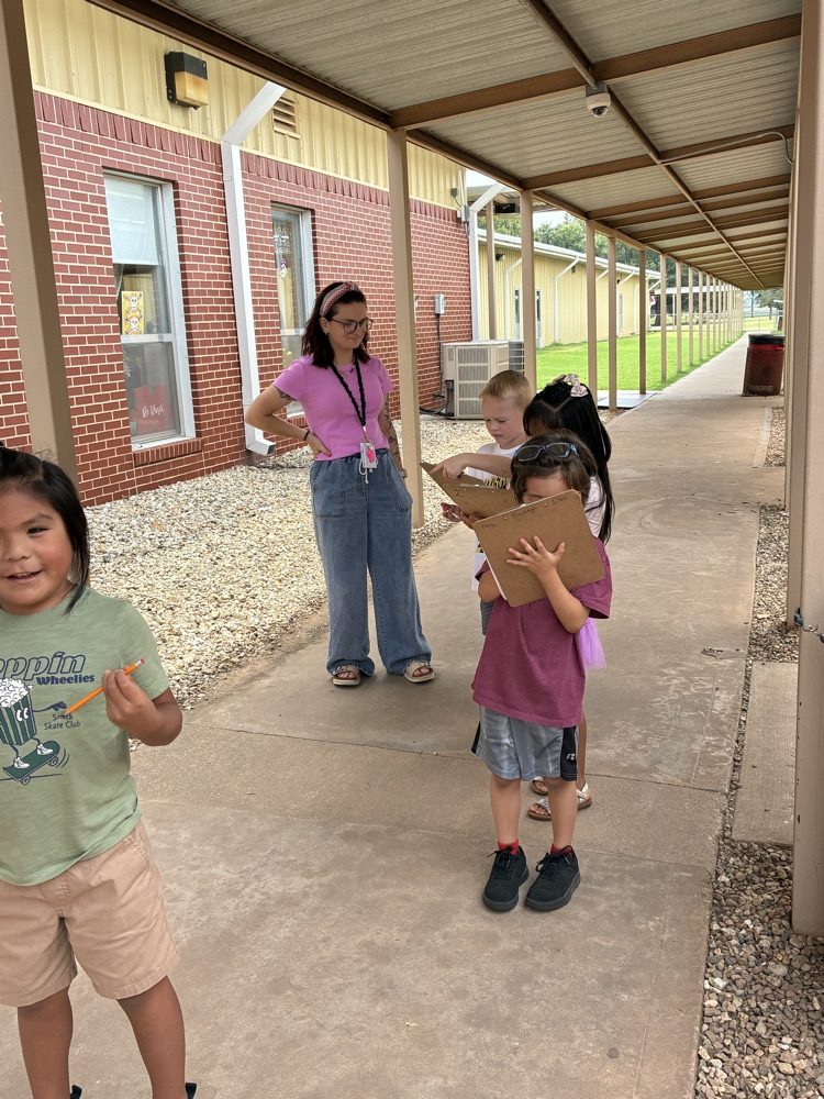 student writing outside