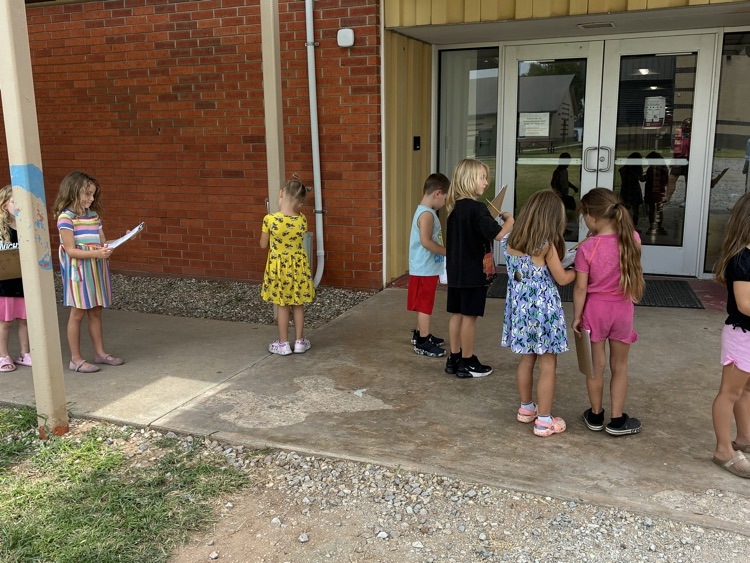 students outside with clipboards