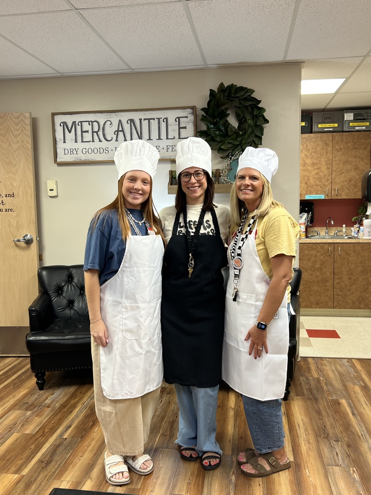 Teachers dressed up like chefs