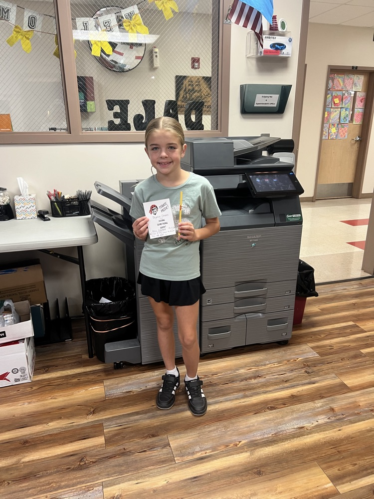 Student holding a pirate pride award