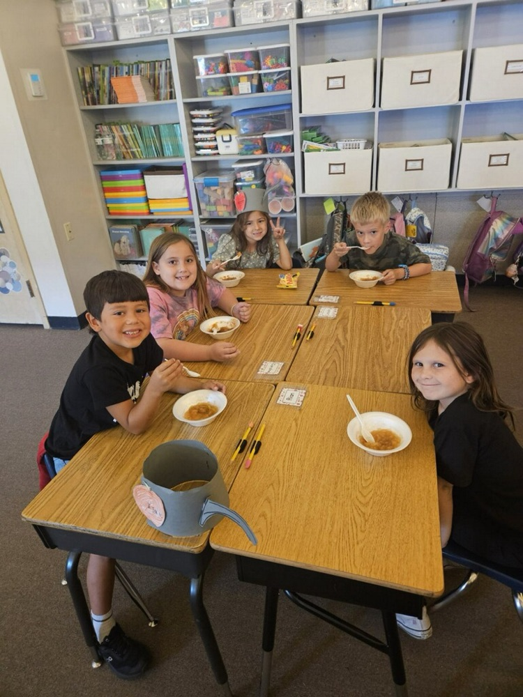 students eating an apple treat
