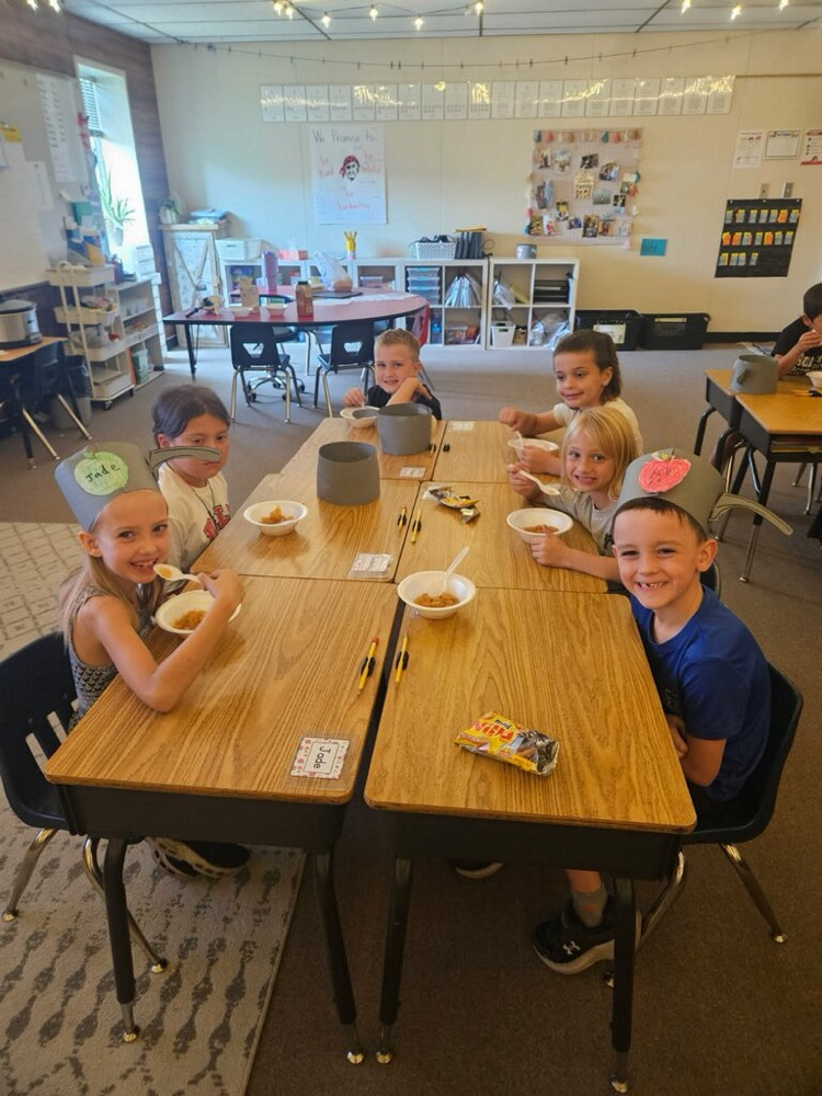 students eating an apple treat
