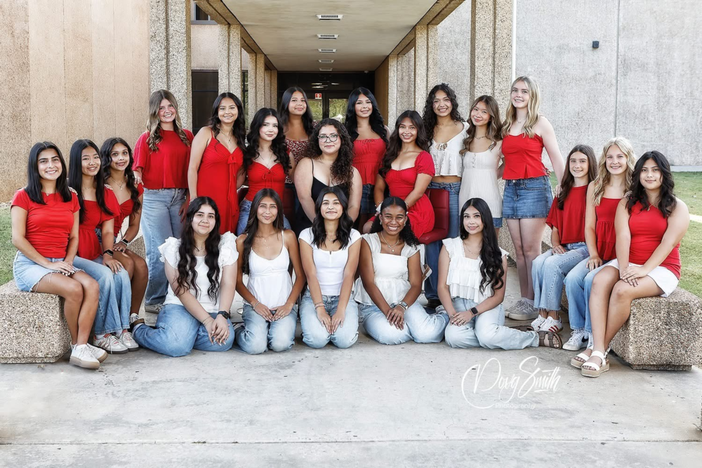 a group of girls smile together for a large group photo