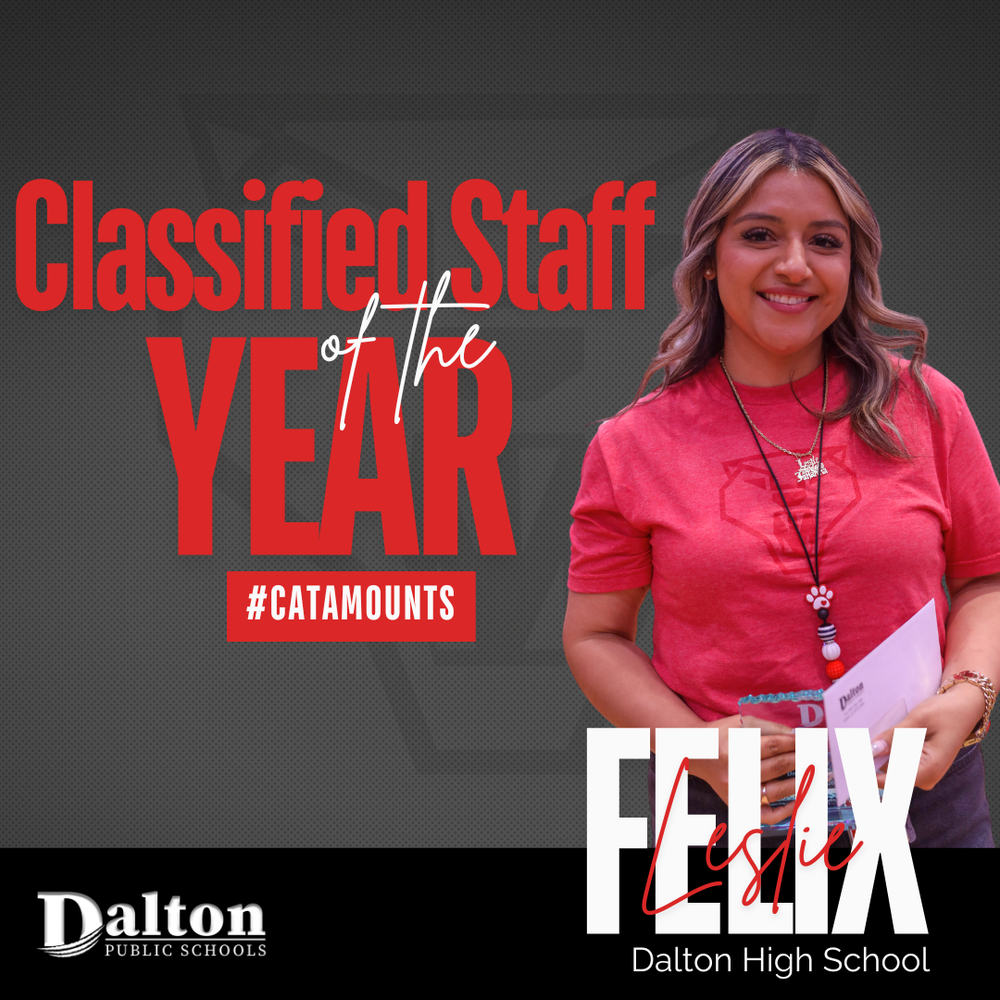 A promotional graphics flyer celebrating "Classified Staff of the Year" against a dark gray background. On the left, bold red text reads "Classified Staff of the Year" with "#CATAMOUNTS" underneath in a red box, and the Dalton Public Schools logo at the bottom left. On the right, a smiling woman named Leslie Felix wears a bright red t-shirt, necklace, and lanyard while holding an award and an envelope. Her name "FELIX Leslie" is displayed in large white and red typography at the bottom right above "Dalton High School".
