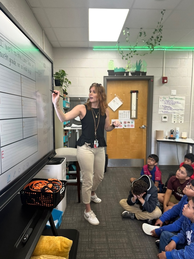 teacher at board in classroom 