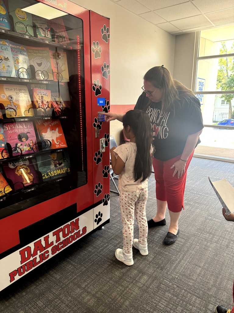 Photo of principal at book vending machine