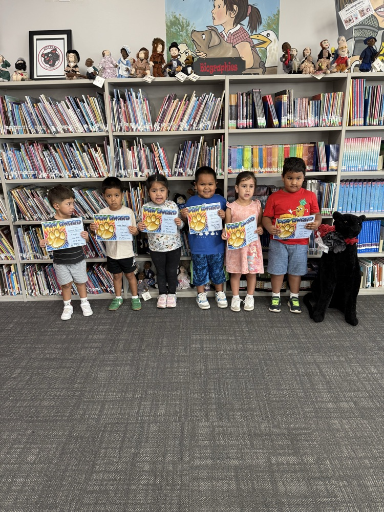 students with certificates of recognition